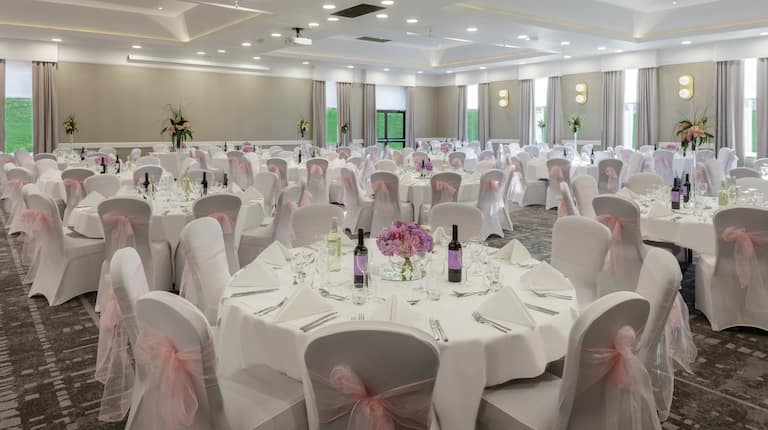 Wedding reception banquet with covered chairs and tables