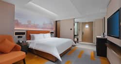 King Superior bed view with Orange chair