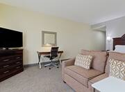 Sofa, TV, and Work Desk in King Deluxe Room