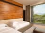 Guestroom with beds and view from window