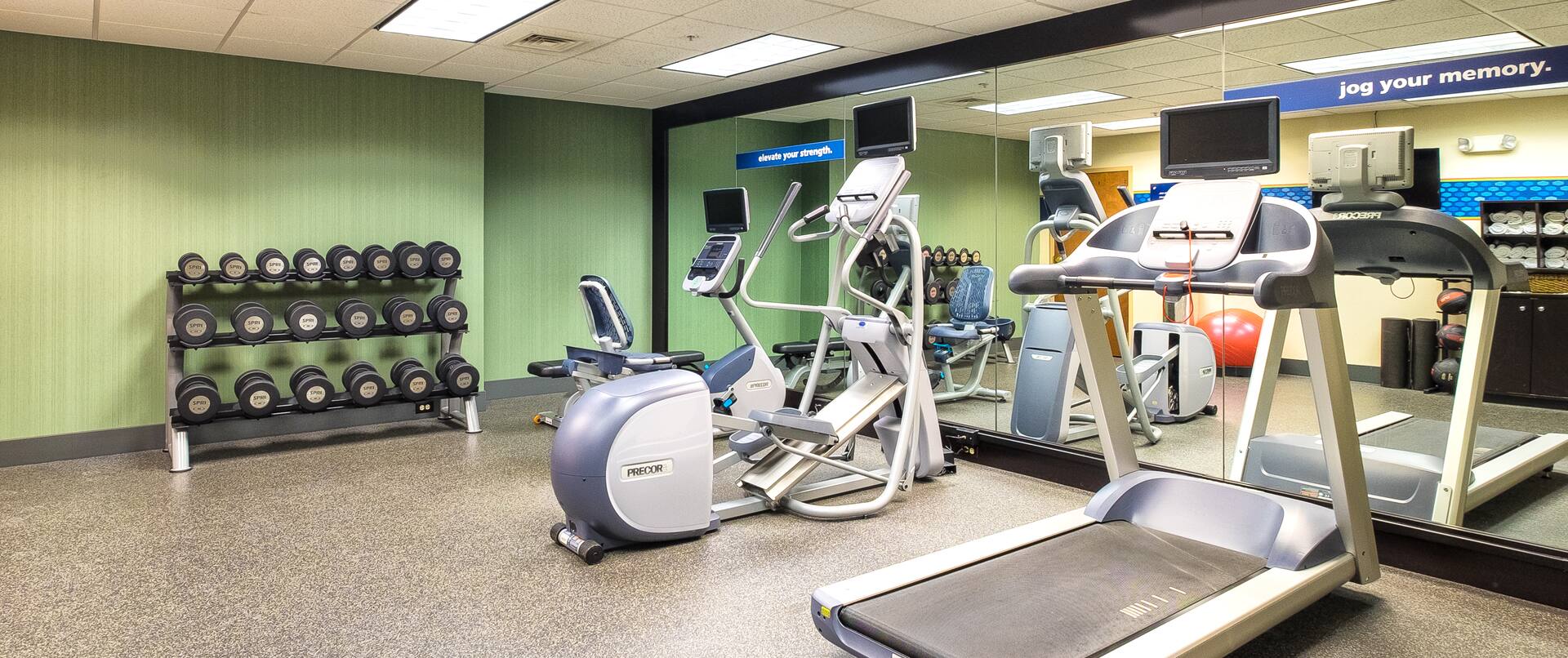 Fitness center with exercise bike, treadmill and free weights