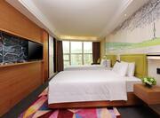Two Twin Beds Guestroom with Room Technology, Lounge Area, and Outside View