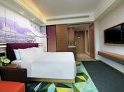 King Superior Deluxe Guestroom with Bed, Lounge Area, and Room Technology