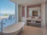 Executive Suite Bathroom with Dual Vanity Area and Bathtub