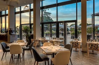 Dining Area with Large Windows of Cannelle Restaurant 