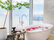 Bathtub with petals and table