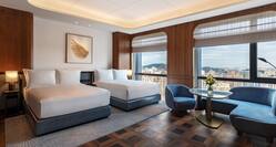 Two Queen Deluxe Room with Seating Area and City View 