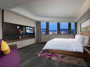 Suite with Kingbed, TV, lounging area and city views