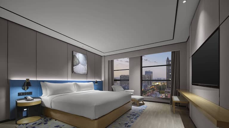 King deluxe suite bedroom with wall mounted TV