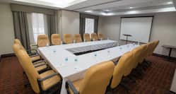 Meeting Room with U-Shape Table Layout and Projector Screen