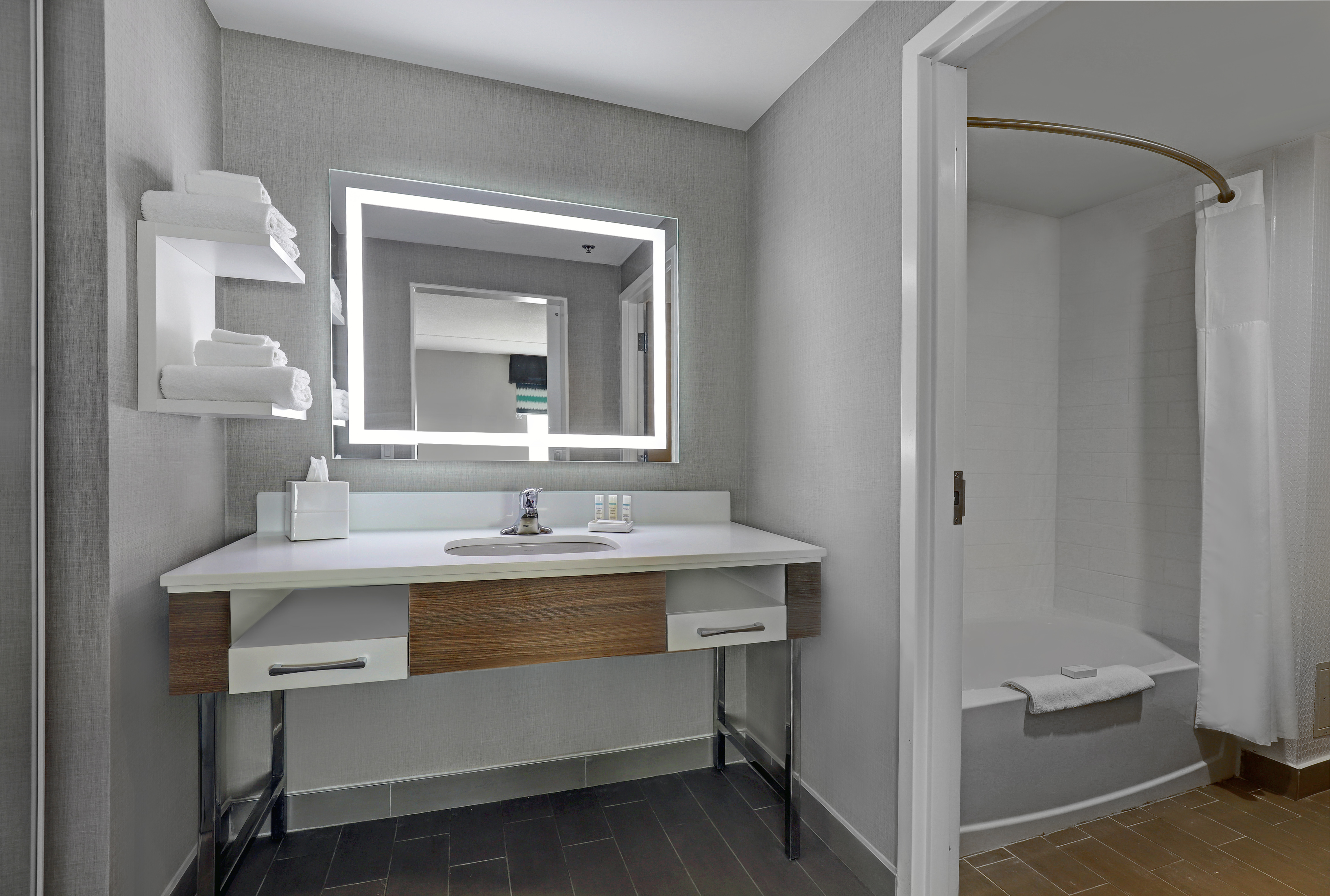 guest bathroom with vanity and tub