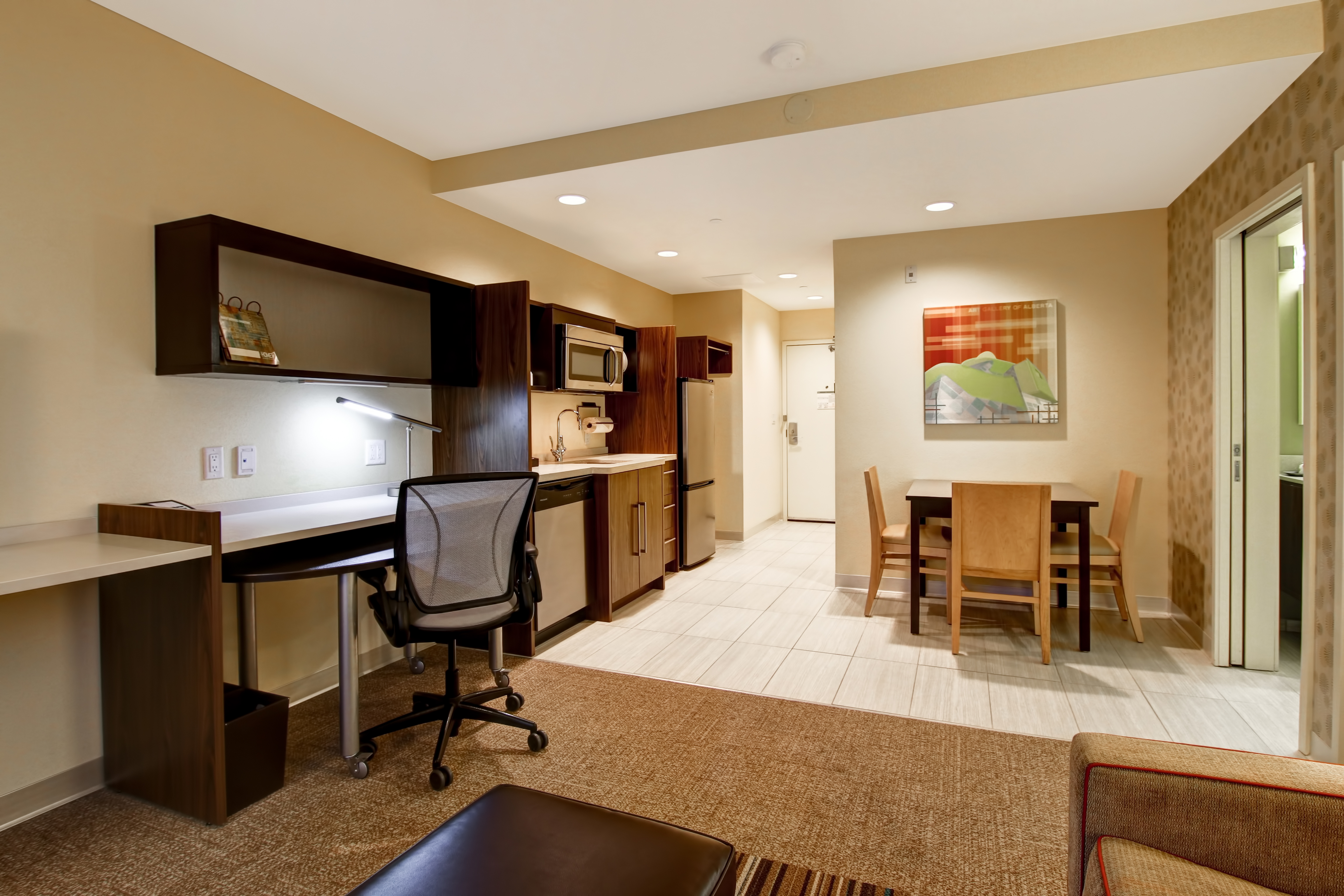 Suite Living Area with Lounge Seating, Work Desk and Kitchen