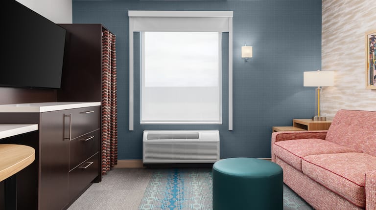 Lounge area with couch and TV