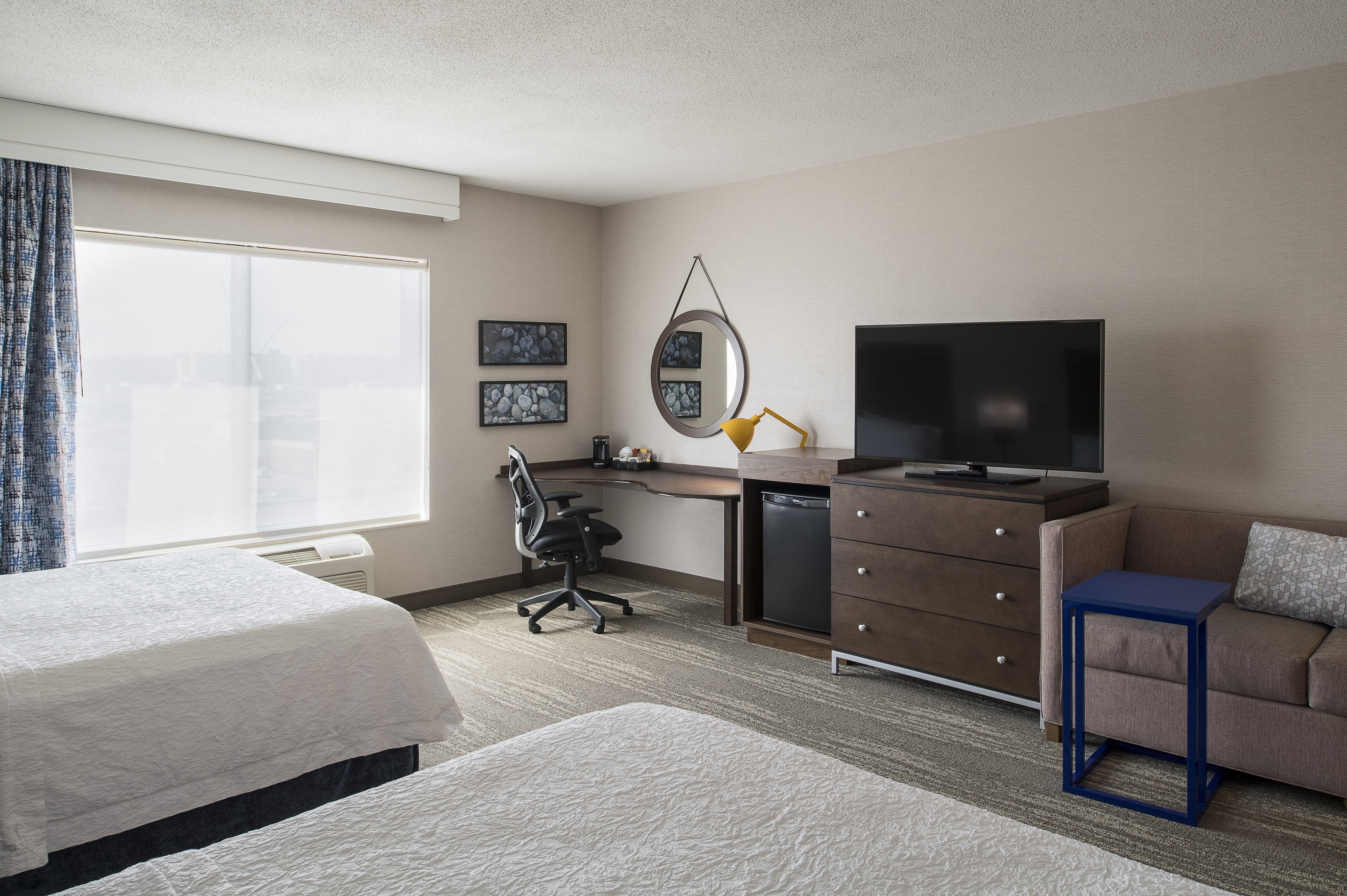Accessible Guestroom with Two Queen Beds, Work Desk, Mini Fridge, Television and Couch