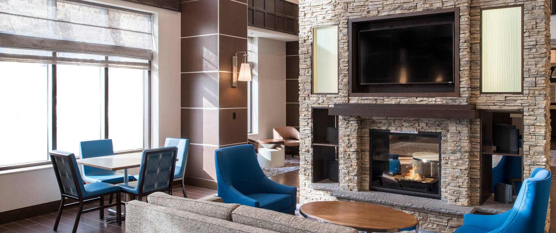 Lobby Seating Area with Fireplace and Television
