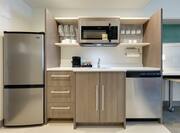 Kitchen area with fridge
