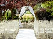 an outdoor wedding ceremony seating area