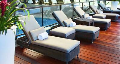 Lounge Chairs in Front of Indoor Pool