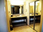 Studio Bathroom Vanity Area with Large Mirror