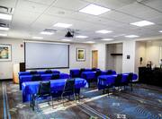Meeting Room Classroom Style Setup with Projection Screen