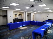 Chairs and Tables in U-Shape Style Setup in Meeting Room 