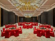 Huijin Ballroom Setup with Red Round Tables and Chairs
