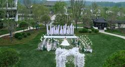 Aerialview of outdoor lawn wedding area with bride