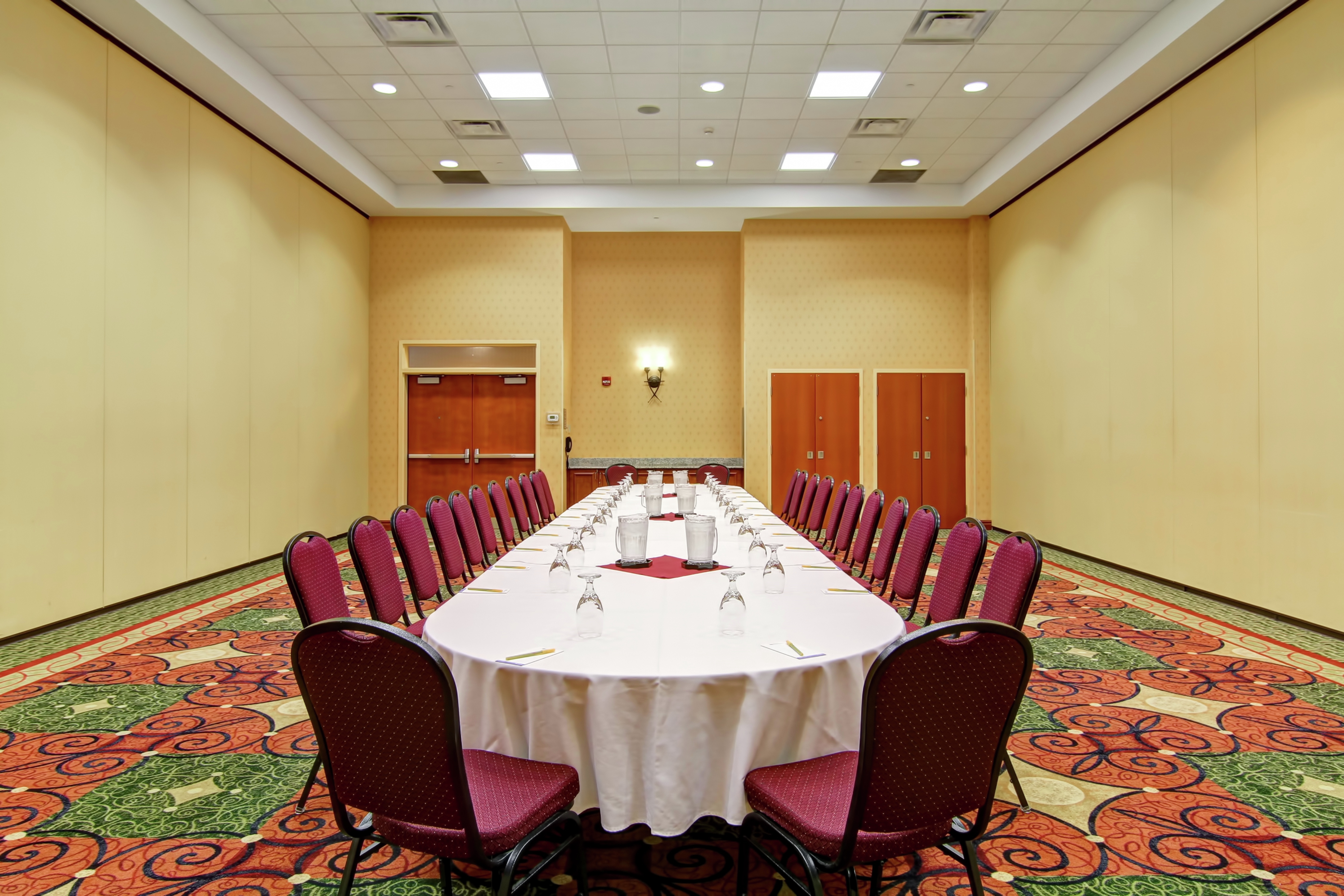 Meeting Space Set Up With Seating at Boardroom Table