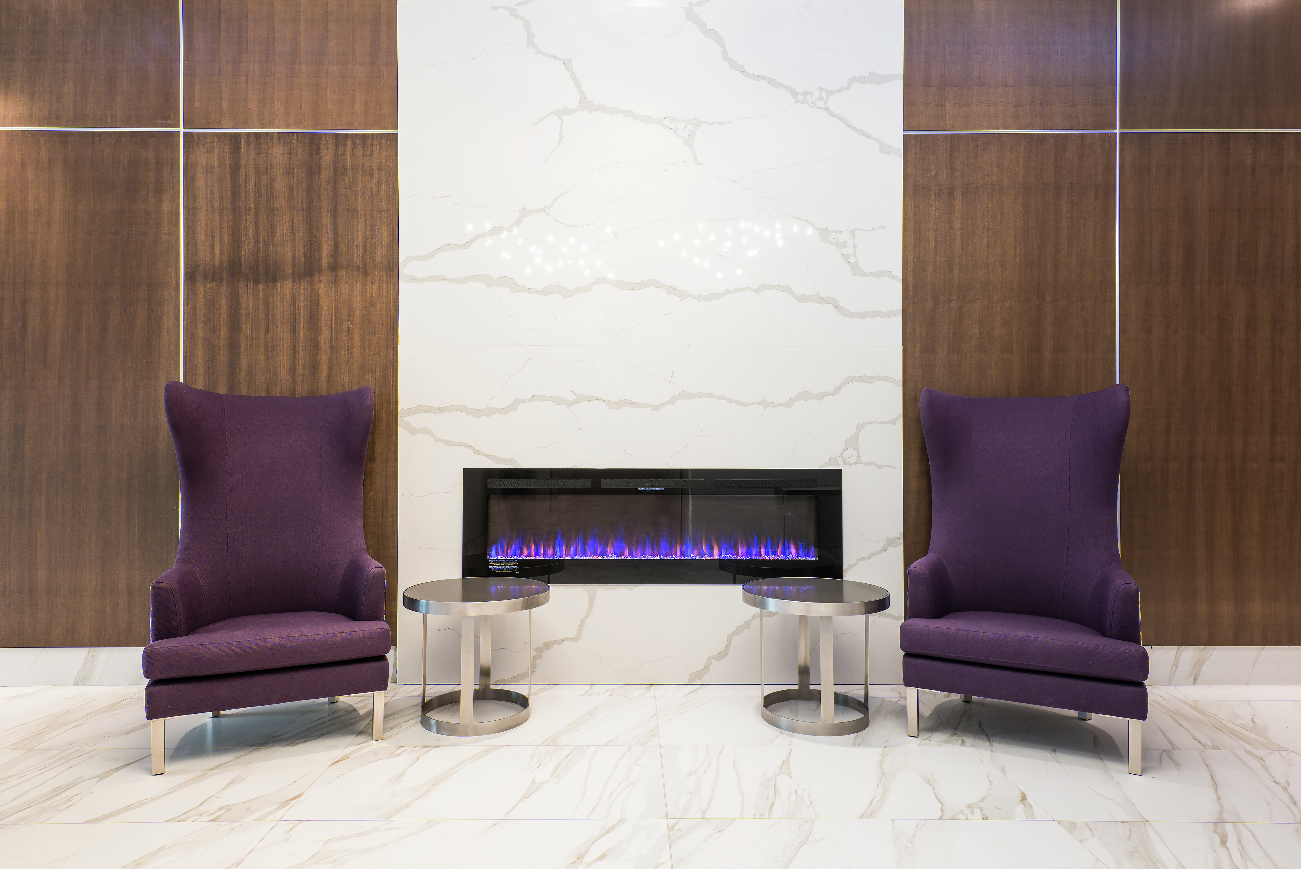 Lobby Fireplace Area with 2 Soft Chairs