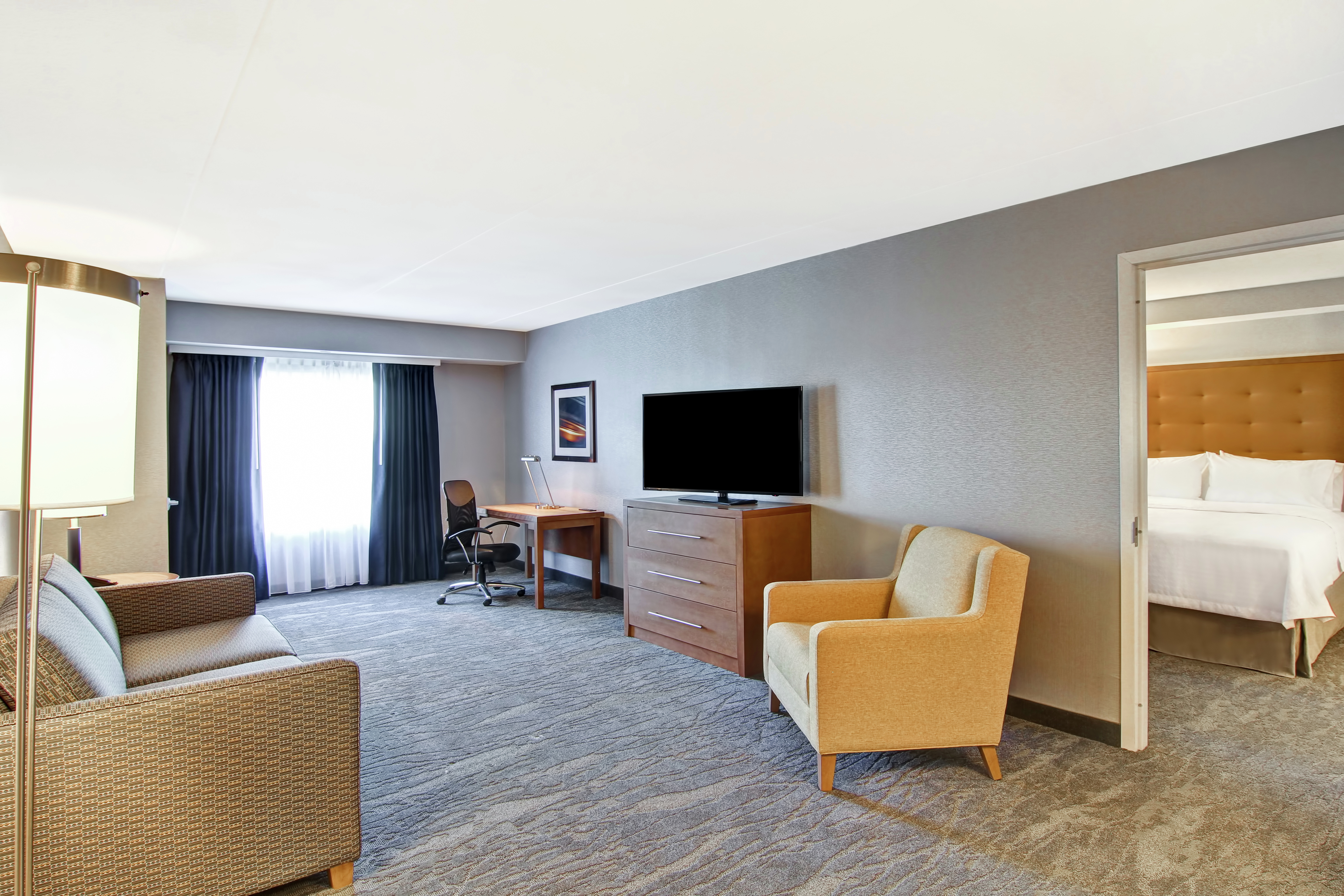 Suite living area with tv and comfortable seating