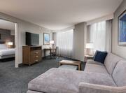King Suite with Bed, Lounge Area, Work Desk, and Room Technology
