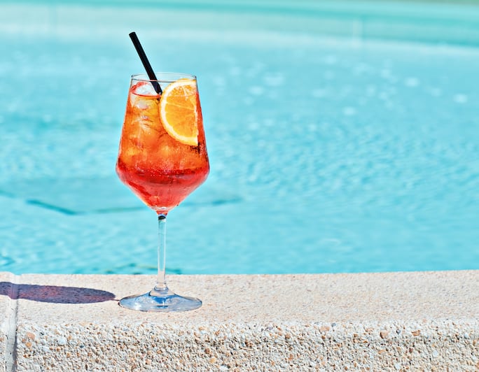Cocktail at side of outdoor swimming pool 
