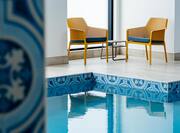 Indoor Pool with Comfortable Seating Area
