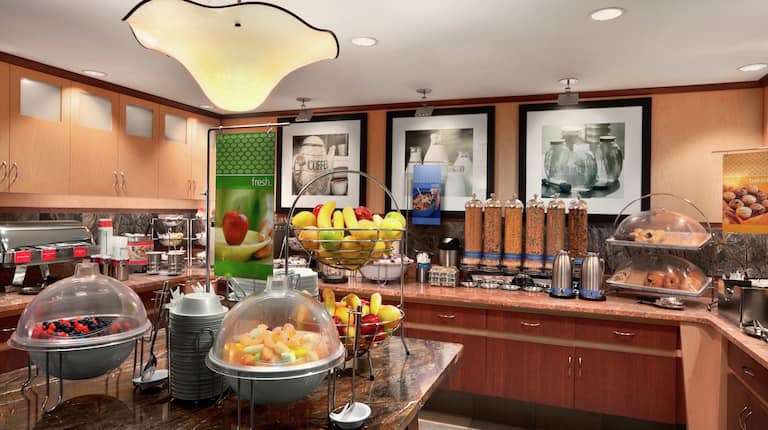 Breakfast Buffet Area with Fruit Bowls and Coffee Dispensers