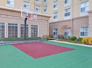 Outdoor Multi-Purpose Sport Court With Basketball Goal