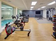 Fitness room with view of indoor pool