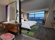 guest room with 2 beds, bathroom, city view