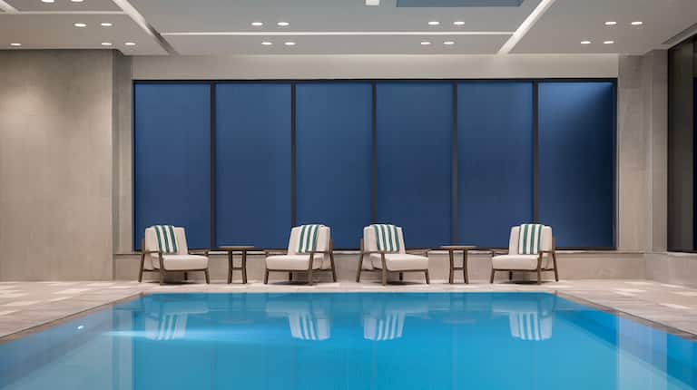 indoor pool, tables, chairs