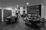 hotel meeting room, social set up, round tables, dinner ware