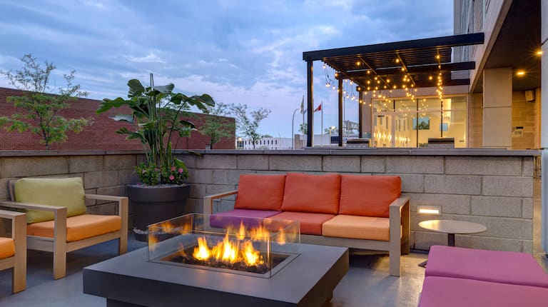 outdoor patio with fire pit at dusk