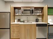 Suite Kitchen with Refrigerator, Dishwasher, Microwave, and Sink