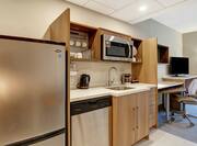 Suite Kitchen with Refrigerator, Dishwasher, Sink, and Microwave