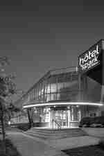 Hotel exterior with entrance and brand signage