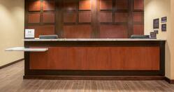 Wooden Front Desk With Granite Counter Top and With Two Reception Stations