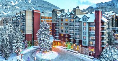 A wintry exterior shot of Hilton Whistler Resort & Spa