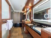 Suite Bathroom with Double Sink and Separate Tub