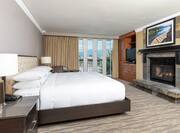 Suite Bedroom with King Bed and Stone Fireplace
