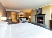 Seating Area, King Bed and a Stone Fireplace