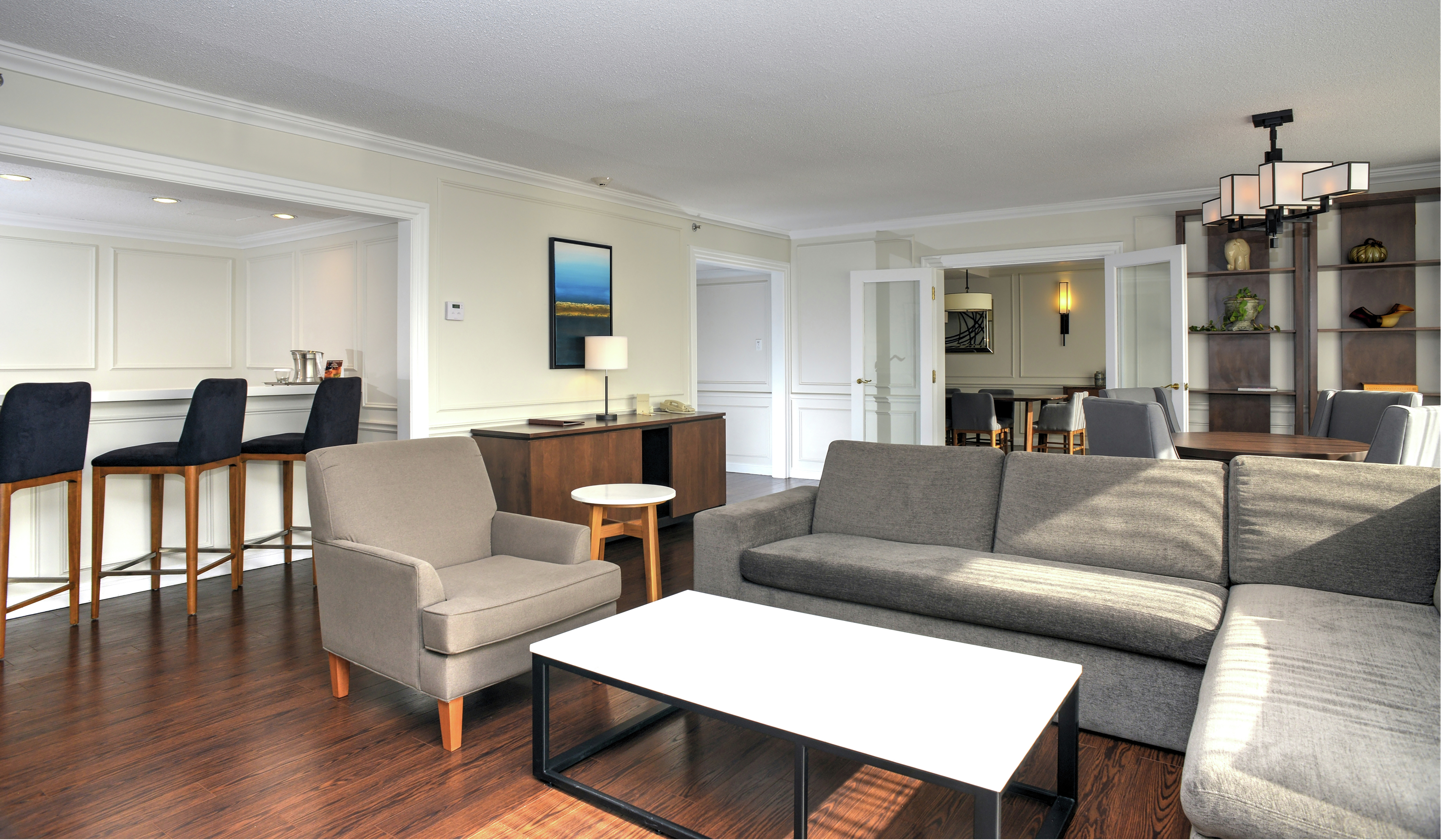 Prime Minister Suite Living Area with Grey Sofa, Chair and Coffee Table