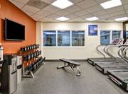 Fitness Center with Treadmills, Weight Bench, Dumbbell Rack and Wall Mounted HDTV